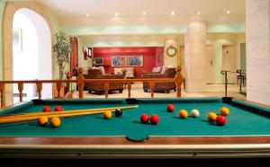 a living room with a pool table with balls on it at Hotel Balear in Can Pastilla