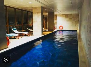 a hotel room with a swimming pool in a building at Taj Hotel Cape Town - Taj Residence suite ,let out privately in Cape Town