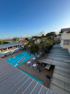 an aerial view of a resort swimming pool at Hôtel - Appartement meublé " LES FLOTS BLEU " in Antananarivo