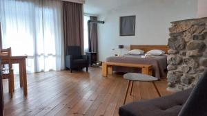 Un pat sau paturi într-o cameră la Bapsha Guesthouse