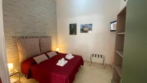 Postel nebo postele na pokoji v ubytování O'Paisi Casa Vacanze