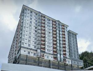 a tall building with many windows on the side of it at BC Homestay @ Emerald Avenue Apartment, Brinchang in Brinchang
