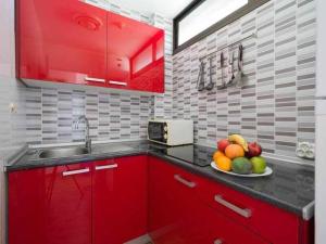 Kuchyň nebo kuchyňský kout v ubytování Marlenghi Apartments 412