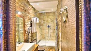 a bathroom with a shower with a glass door at Location front de mer de Thierry Bourgait in Banyuls-sur-Mer +11 photos