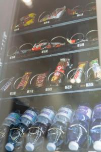 a shelf filled with lots of soda cans at B&B alla Ferrovia in Naples