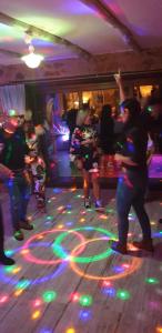 a group of people dancing on a dance floor with lights at Casa BelaVista Penela - Charming Guest House - Adults Only in Penela