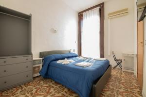 Posteľ alebo postele v izbe v ubytovaní MADB&B