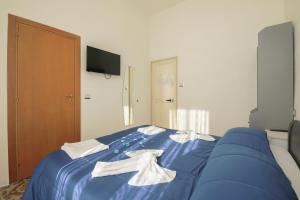 Posteľ alebo postele v izbe v ubytovaní MADB&B