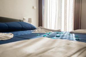 Posteľ alebo postele v izbe v ubytovaní MADB&B