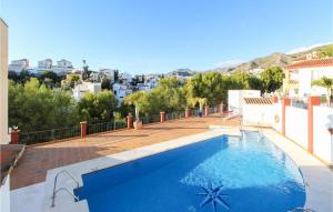 a swimming pool on the roof of a house at 3 Bedroom Stunning Apartment In Nerja in Nerja