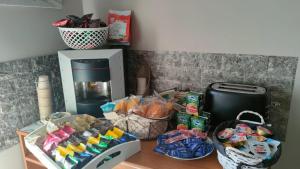 a counter top with snacks and a coffee maker at B&B Stadio in Catanzaro +20 photos