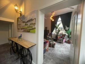 a hallway with a table and a living room at Boutique Hotel in Bad Salzuflen