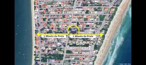 an aerial view of a beach with a yellow circle at Hotel Pousada Ilha do Mar Bombinhas in Bombinhas