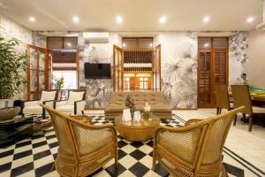 a living room with a couch and chairs and a table at San Pedro Claver Luxury in the walled city in Cartagena de Indias