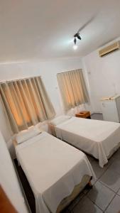 Un pat sau paturi într-o cameră la Granvalle Hotel Juazeiro