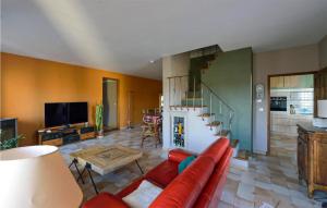 sala de estar con sofá rojo y escalera en Cozy Home In Lanon-provence With Private Swimming Pool, Can Be Inside Or Outside, en Lançon-Provence