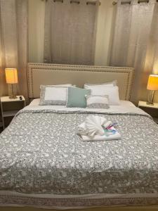 a bed with a tray of toothbrushes on it at Amazing Room in Newark