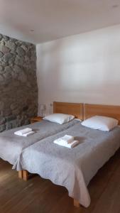 Un pat sau paturi într-o cameră la Bapsha Guesthouse