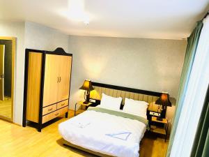 Ένα ή περισσότερα κρεβάτια σε δωμάτιο στο Green Hotel ANG