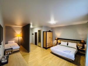 Ένα ή περισσότερα κρεβάτια σε δωμάτιο στο Green Hotel ANG