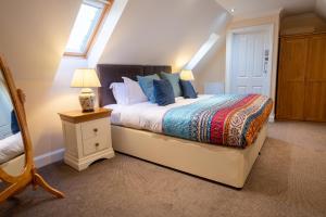 מיטה או מיטות בחדר ב-Terlingham Lane Cottage