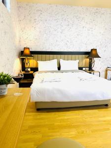 Ένα ή περισσότερα κρεβάτια σε δωμάτιο στο Green Hotel ANG