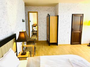 Ένα ή περισσότερα κρεβάτια σε δωμάτιο στο Green Hotel ANG