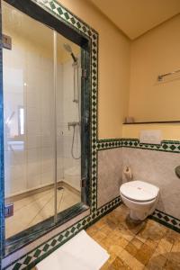 a bathroom with a shower and a toilet at Ibis Meknes in Meknès