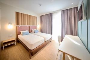 Postel nebo postele na pokoji v ubytování Hotel Leonor Conil