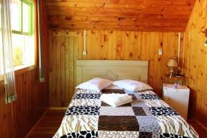 Cama ou camas em um quarto em Pousada Oliveira - Cambara do Sul-RS