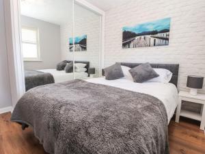 מיטה או מיטות בחדר ב-Beachway