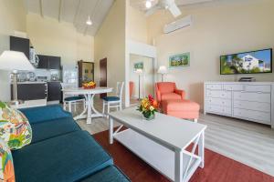 a living room with a couch and a table at La Vista Resort in Simpson Bay