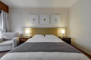 Ένα ή περισσότερα κρεβάτια σε δωμάτιο στο Suite at the Grand Plaza Avenida Paulista