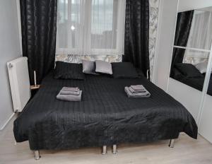 Łóżko lub łóżka w pokoju w obiekcie Le nid douillet