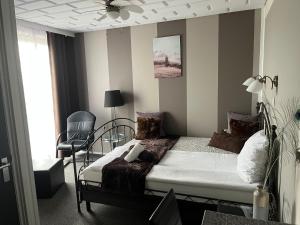מיטה או מיטות בחדר ב-Hotel Dijkzicht