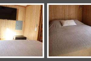 Una cama o camas en una habitación de Driftwood Cabin - 2nd Street