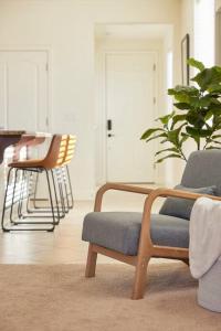 a living room with a chair and a plant at NEW Upscale House, Tahoe 30-min w/ Cal King in Steamboat