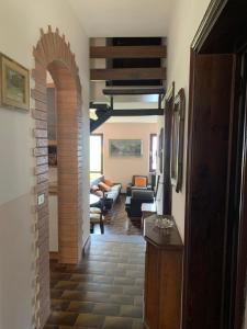 a hallway with a living room and an archway at Villa Angela in Dorio