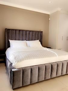 Ένα ή περισσότερα κρεβάτια σε δωμάτιο στο Oasis of Comfort +22 φωτογραφίες