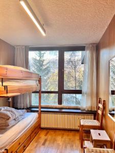 Postel nebo postele na pokoji v ubytování Home Vetta Bianca Le Volpi Marilleva 1400
