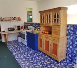 a kitchen with a stove and a counter top at Playa El Obipo C La Marea building La Libertad in La Libertad