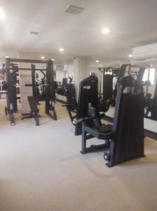 a gym with rows of treadmills and exercise equipment at Flat praia dos carneiros eco resort 26 in Tamandaré