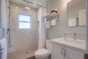 a bathroom with a toilet and a sink and a shower at 7BD Family, Event Friendly, 2 blocks to Beach, Boardwalk in San Diego