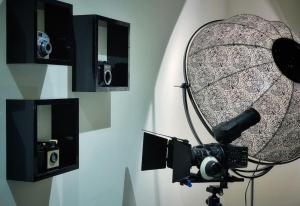 a camera and a microphone on a wall at Two Bedroom Luxury Apt with film style in Swansea