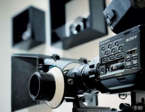 a close up of a camera with a microphone at Two Bedroom Luxury Apt with film style in Swansea