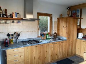 a kitchen with a sink and a counter top at Chalet Gorret in Torgnon