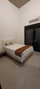 Ένα ή περισσότερα κρεβάτια σε δωμάτιο στο Casa em Barequeçaba recém construída Alto Padrão