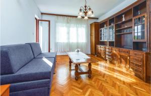 a living room with a couch and a coffee table at Lovely Apartment In Podstrana With Kitchen in Podstrana