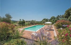 a swimming pool in the middle of a garden at Egidio in Vigne