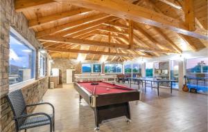 a large room with a pool table in it at Beautiful Home In Neoric With Private Swimming Pool, Can Be Inside Or Outside in Neorić